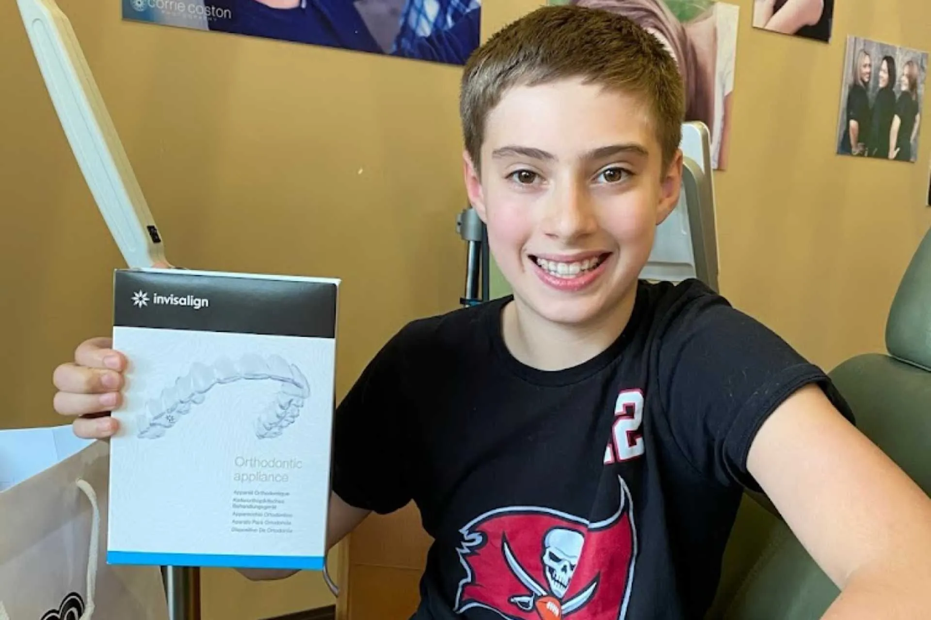 Happy kids smiling together with orthodontic appliances